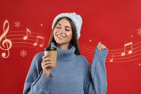 Smiling woman in a winter hat holding a coffee cup and enjoying Christmas music, with music notes and snowflakes on a red background